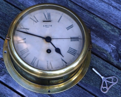 Early 20th century Smith 8 day ships clock made in England. Brass, incl key. 
