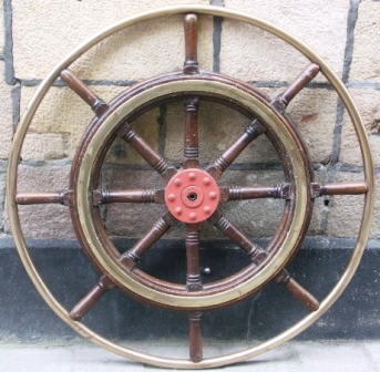 Early 20th century eight-spoked teak ships wheel with double brass bands and brass frame