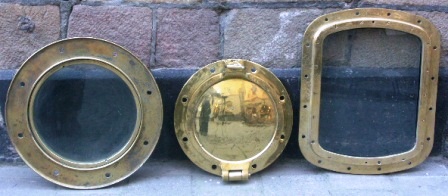 20th century rectangular and round brass portholes with and without "storm-lid".