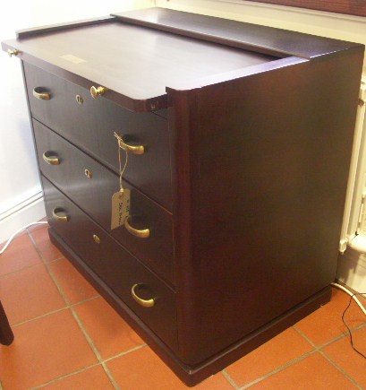 Chest of three drawers and with a sliding leaf. Mahogany and brass from the Italian liner M/N G. Verdi.