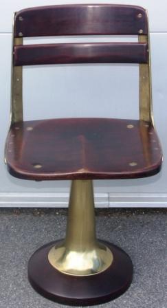 Swivel-chair in mahogany and brass from American Seating Company