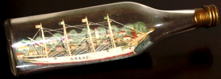 Early 20th century sailor-made ship model housed in bottle depicting the 4-masted Swedish barque ARRAC