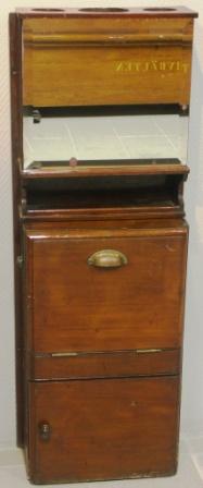 Mahogany wash cabinet for wall mounting with porcelain basin and brass tap. Made by A & R Smith Glasgow. Incl mirror, shelf as well as holder for glasses and decanter. Water container and portable wastewater bucket missing.