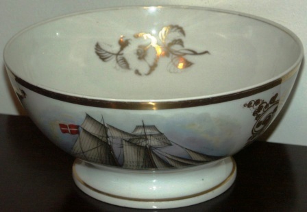 19th century Captains' bowl made in porcelain and used for presentation to captains sailing through the Sound of Elsinore, Denmark. Decorated with a finely painted Danish two-mast sailing vessel. Signed with initials and dated November 14, 1859.