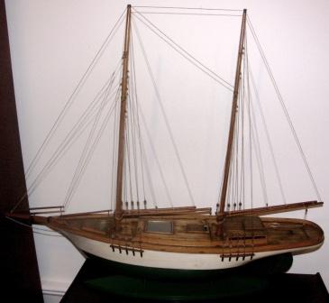 Early 20th century built wooden model depicting a two-masted gaff-rigged yacht.