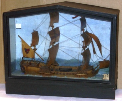 Early 20th century built diorama depicting a Mediterranean sailing vessel in full sails.