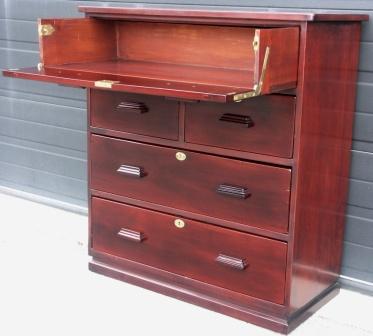 Chest of four drawers and one desktop tray with folding front made in mahogany and with brass fittings. From the freighter M/S Atlantik, Hamburg.