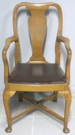 Numbered armchair in golden oak. Leather seat. Early 20th century.