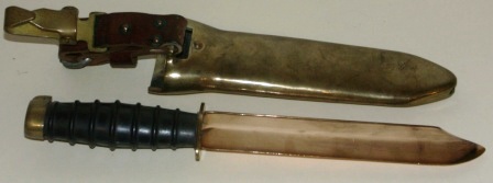 20th century diving knife made in the USSR. Brass sheath, antimagnetic single edged blade and rubber-dressed handle. Leather and brass buckle. 