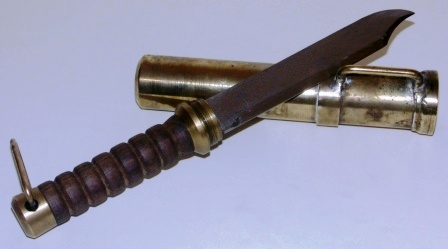 20th century screw-in type Polish diving knife. Wooden handle, brass sheath and single edged stainless blade.