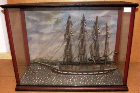 19th century sailor-made model depicting the Swedish 4-masted barque EJGENIA, flying the Union Flag. Painted background depicting coastal scenery and French steamer COLUMBIA. 