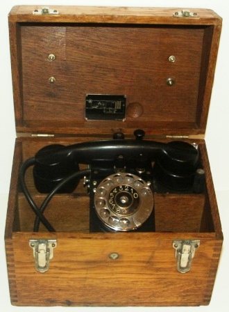 Early 20th century portable Swedish defence department telephone. Made by Ericsson, crown-marked S179. In original oak box.