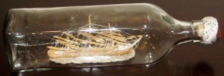 Mid 20th century sailor-made ship model housed in bottle depicting a Swedish full-rigged ship