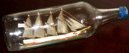 Early 20th century sailor-made ship model housed in bottle depicting the 4-masted Finnish schooner HELENA of RAUMA