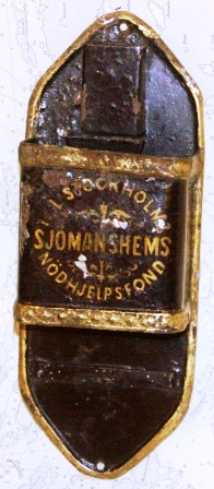 19th century savings-box made in painted tin-plate for the benefit of ''Stockholms Sjömanshems Nödhjelpsfond''