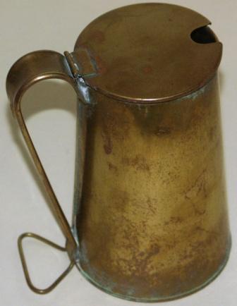 20th century anonymous brass oil jar. 