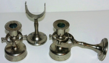 A pair of late 19th century candlesticks made in white metal, mounted in gimbals on wall brackets (detachable). 