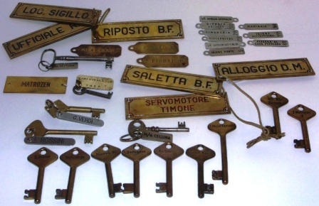 20th century assortment of keys and plates from different vessels, mainly in brass.