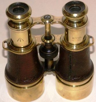 Late 19th century leather-bound brass binocular. Marked MG (+ illegible sign)