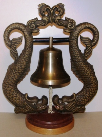 1930's/1940's brass bell mounted in metal bell-frame, solid wooden base. Made by Oskarshamns shipyard-foundry.