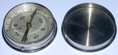 Early 20th century pocket compass in stainless metal box. 
