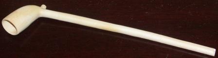 18th century clay pipe fitted with the initials O:F (Olof Forsberg) and decorated with a chain of dots around the head of the pipe. Model dated 1759.
