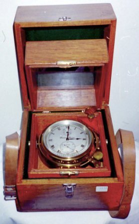20th century two-day marine chronometer mounted in gimbals in original mahogany case fitted with brass carrying handles. Made by Thomas Mercer. Incl transportation case.