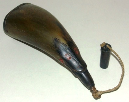 19th century gunpowder horn with wood fittings and brass measurement, animal decorations. 