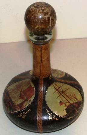 Early 20th century decanter. Leather-bound, with maritime motifs. 