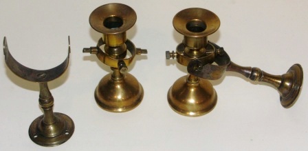 A pair of late 19th century candlesticks made in brass, mounted in gimbals on wall brackets (detachable).