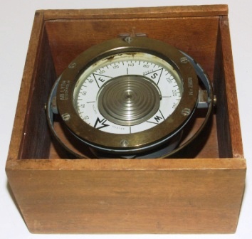 20th century compass in brass, made by AB Lyth, Stockholm. No 29839. Mounted in gimbal, in original wooden box.