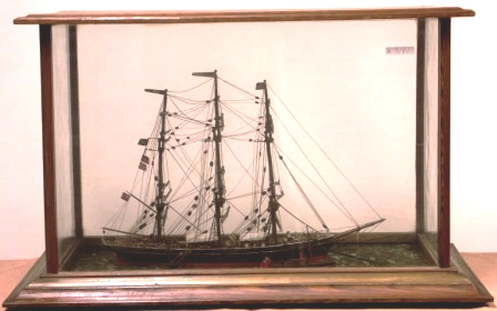 Early 20th century sailor-made diorama. Depicting the British full-rigged ship MARY at anchor together with approaching tug-boat. Mounted in origianal wooden case. 