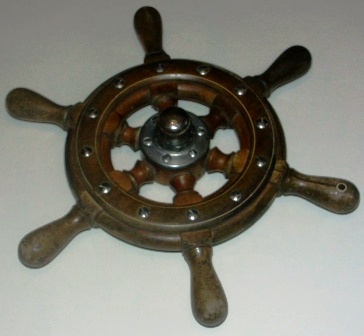 20th century six-spoked teak ships wheel. With central crome-plated brass hub.