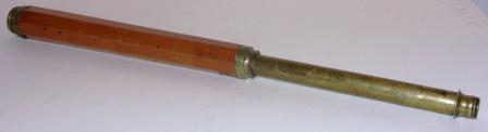 Late 19th century hand-held refracting telescope, maker unknown. One brass draw, mahogany and brass bound tube.