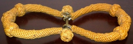 A pair of 20th century sailor-made sea-chest beckets. Dressed in laquered rope. 