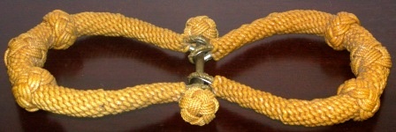 A pair of 20th century sailor-made sea-chest beckets. Dressed in laquered rope.