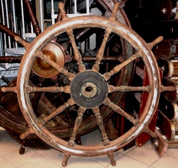 Late 19th century ten-spoked ships wheel. Made of teak. With double brass bands and central brass hub. Made by Elcano - B.D.T. Manises España.