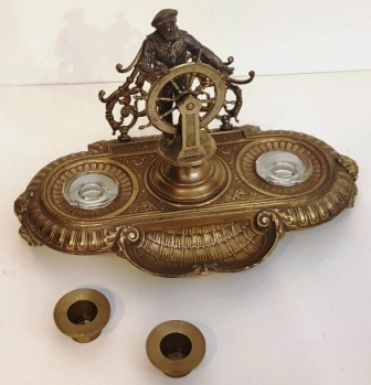 Late 19th century ink-stand in brass with helmsman. Incl both ink- and candleholder.