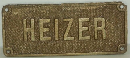 WWII brass plate, salvaged from a German Navy vessel. "Heizer".