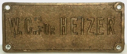 WWII brass plate, salvaged from a German Navy vessel. "W.C. für Heizer".