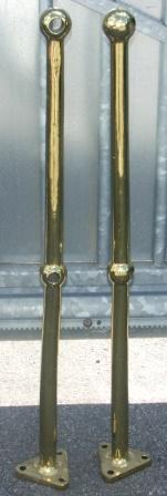 A pair of early 20th century solid brass stanchions