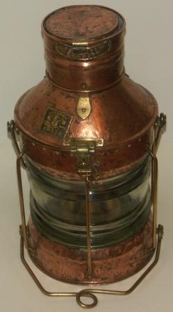 Early 20th century copper and brass anchor light, complete with kerosene burner. Marked Seahorse G.B., Trade mark 40226 "Not under command". 