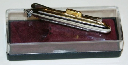 Mid 20th century tie holder depicting a Swedish submarine. In original box. 