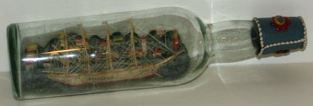 Early 20th century sailor-made ship model housed in bottle 