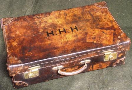 Early 20th century leather suitcase furnished with silver and stainless travelling accessories. Marked with the initials H.H.H. Made by Drew & Sons, Picadilly Circus W. 