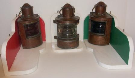 Set of early 20th century kerosene port, starboard and masthead lights. Made of copper. With detachable burner/container and incl stand. 