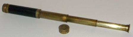 Early 20th century hand-held refracting telescope, maker unknown. Three brass draws and leather bound tube.