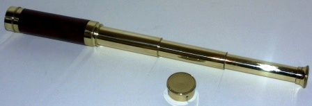 Late 19th century hand-held refracting telescope, maker unknown. With three brass draws and mahogany bound tube.