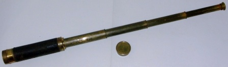 Late 19th century hand-held refracting telescope. Maker unknown. Five brass draws, leather bound tube.