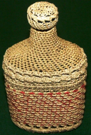 Rope-coated glass bottle with decorative pattern